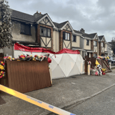 Floral tributes at the house in Birchwood