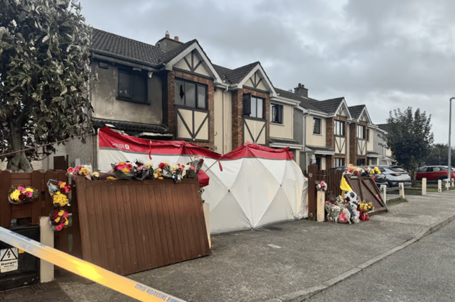 Floral tributes at the house in Birchwood