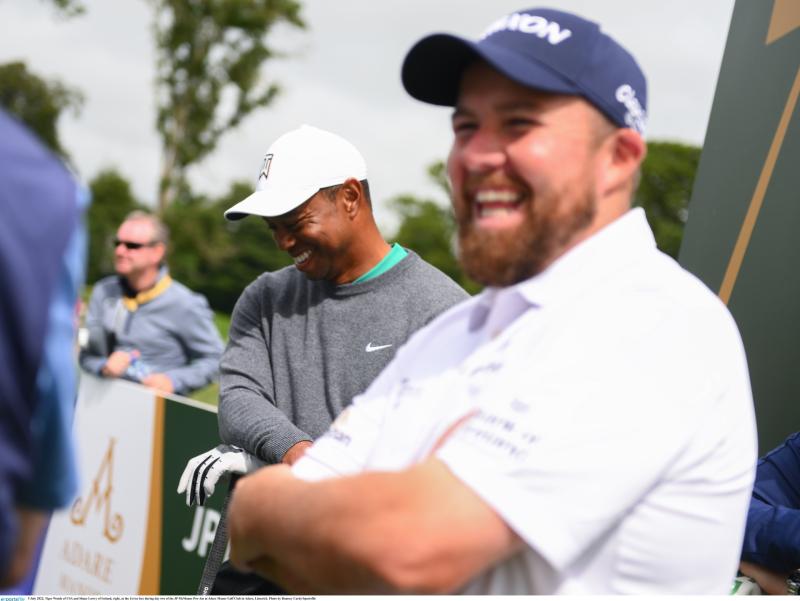 Tiger Woods of USA and Shane Lowry of Ireland, right, at the 7th